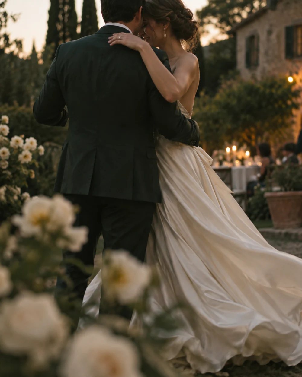 A couple sharing a first dance in an Italian garden